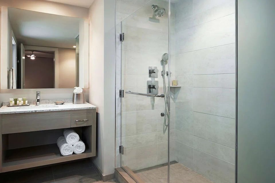 Refresh under a spa-style shower with plush towels.