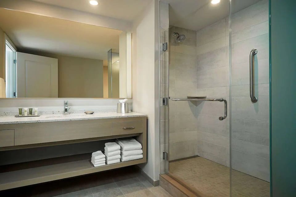 Refresh after the beach in a spa-like glass walk-in shower.