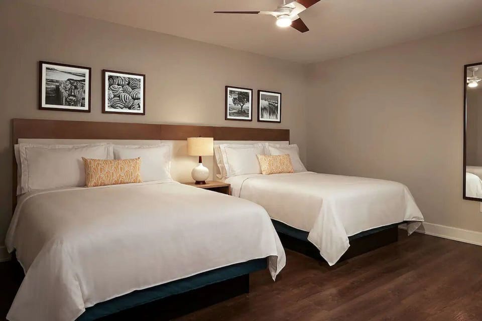 Settle into crisp linens with two queen beds for easy comfort.