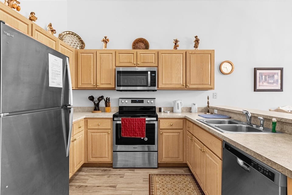 Kitchen With Fridge, Microwave, Stove, Dual Sink & Dishwasher