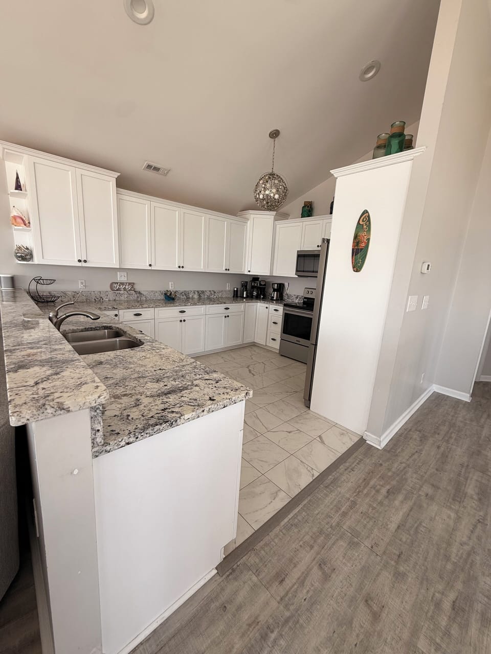 Your fully equipped kitchen features elegant granite countertops, modern appliances, and ample cabinet space—perfect for whipping up meals during your stay.