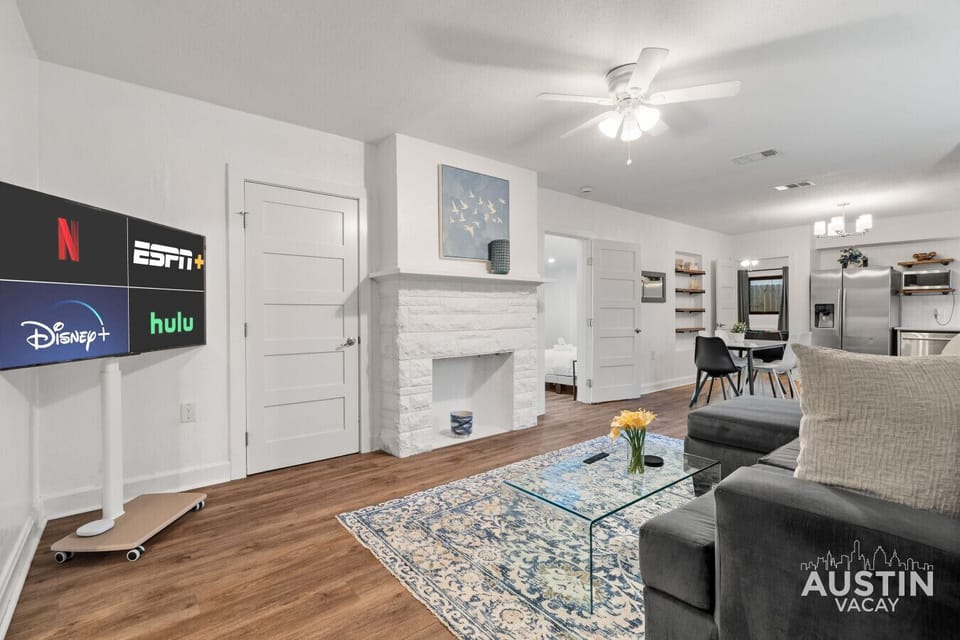 Gather on the sectional and stream your favorites on the Smart TV. Open sightlines connect to the kitchen and dining area.