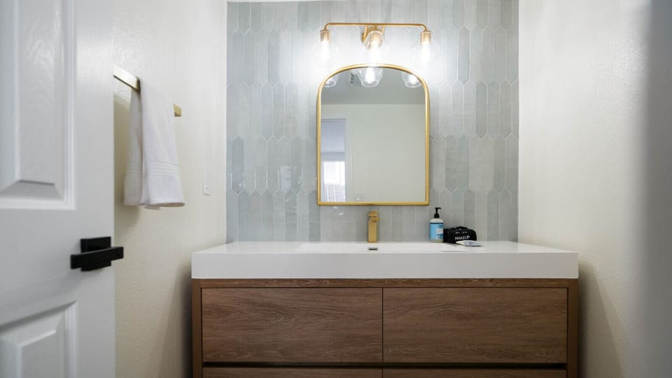Modern bathroom featuring elegant finishes, a stylish vanity, and a clean, refreshing design.