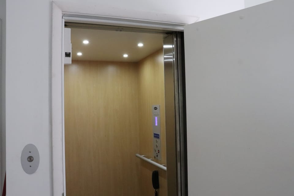 The elevator is ready to carry you and your belongings smoothly between floors, making arrival and departure effortless.
