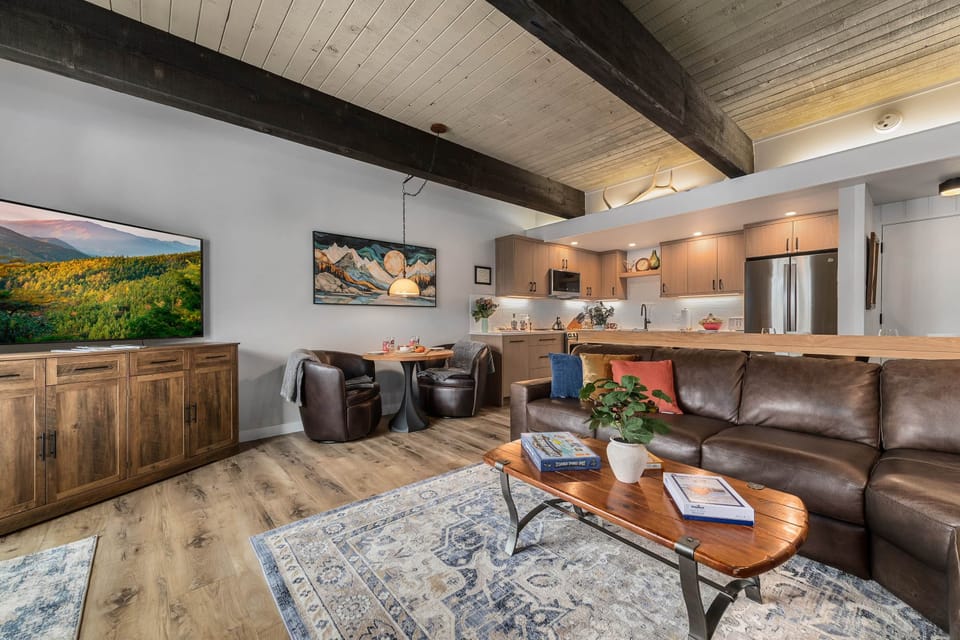 An open living, dining, and kitchen layout creates a warm, connected gathering space