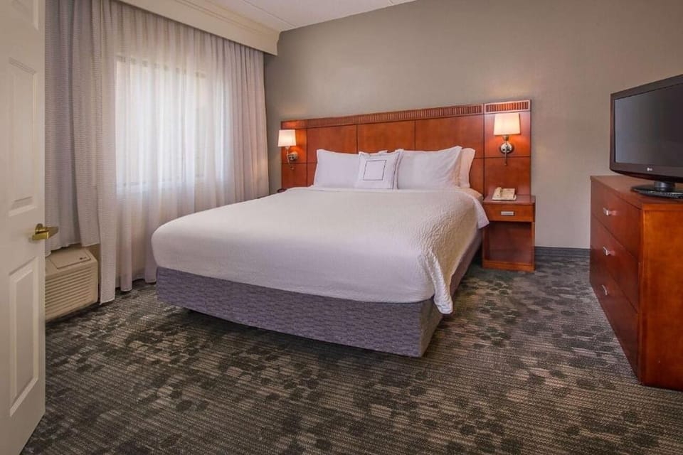 Sink into a plush king bed for deep, quiet sleep.