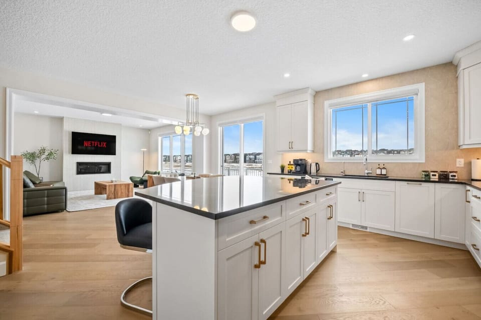 Open-plan kitchen connects seamlessly to dining and family living spaces