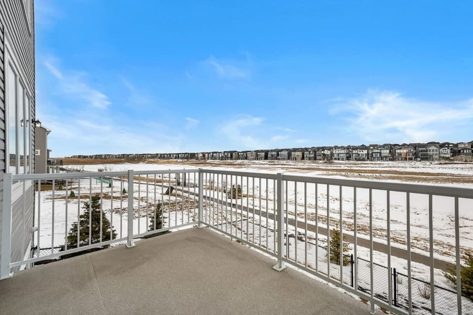 Elevated upper deck with white railings and wide open space views