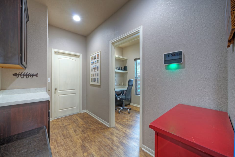 Clean transition area leading to the private home office.