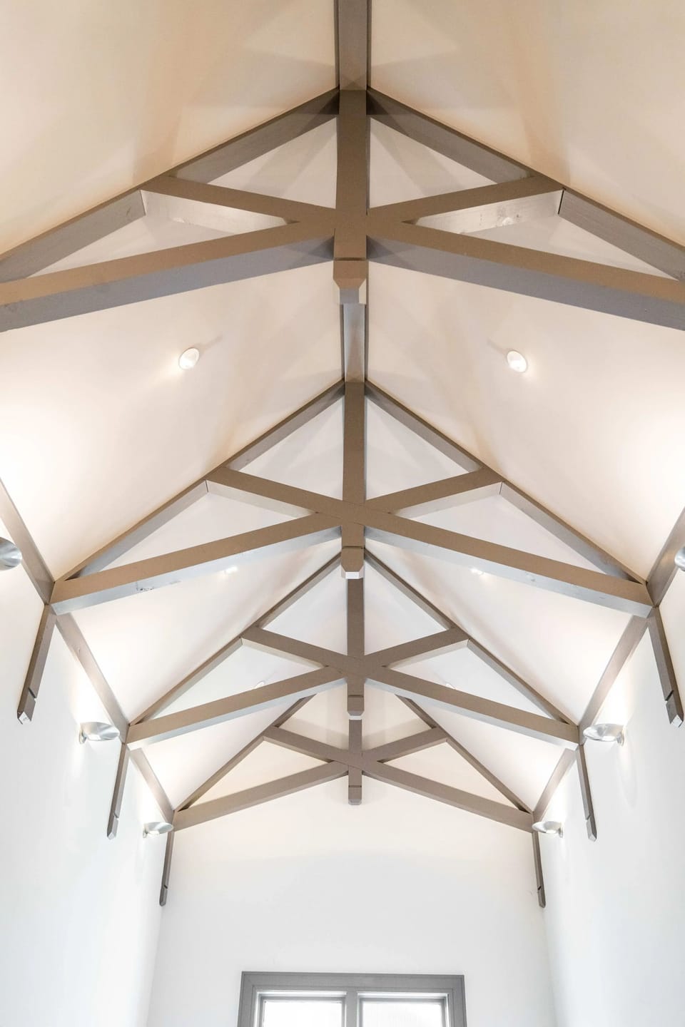 Striking vaulted ceiling w/ exposed beams adding architectural charm