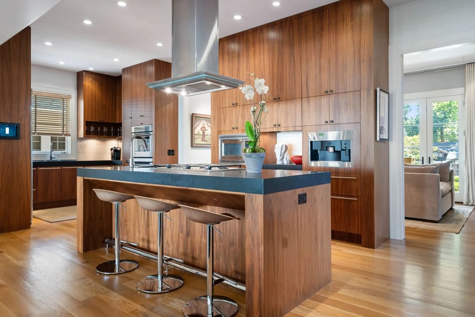 Spacious kitchen island w/ bar seating for casual meals & socializing