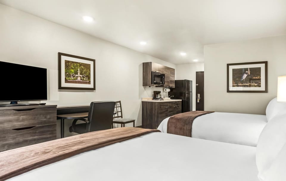 Settle in with cozy bedding and an easy in-room kitchenette.