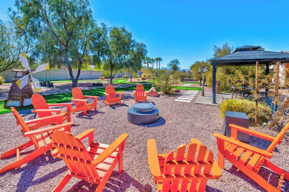Relax around the gas fire pit with Adirondack seating, located next to the 9-hole mini golf course and shaded gazebo lounge area.