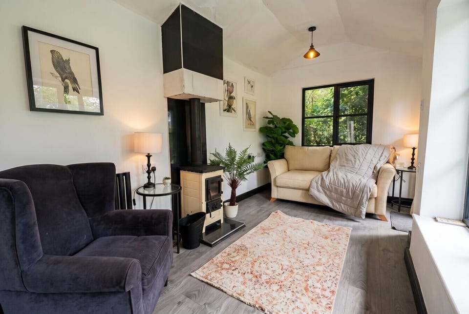 Curl up beside the wood-burning stove with garden views from every seat.