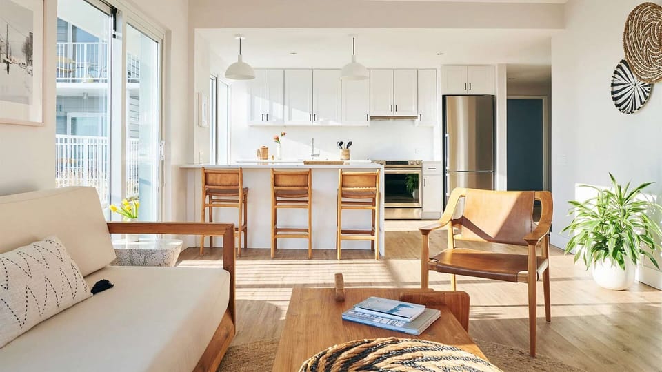 Open living area with bar stools and sofa