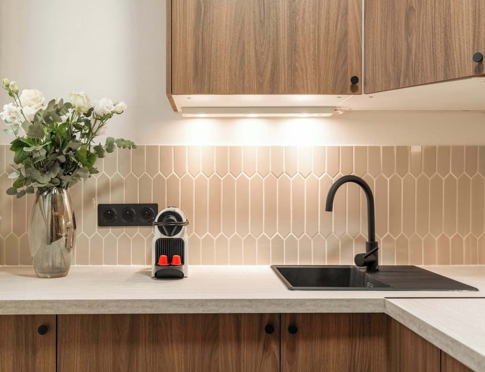 Contemporary kitchen design with top-of-the-line appliances, ensuring a seamless cooking experience.
