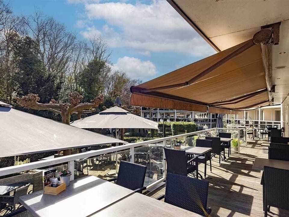 Sip morning coffee under the awning with garden views.