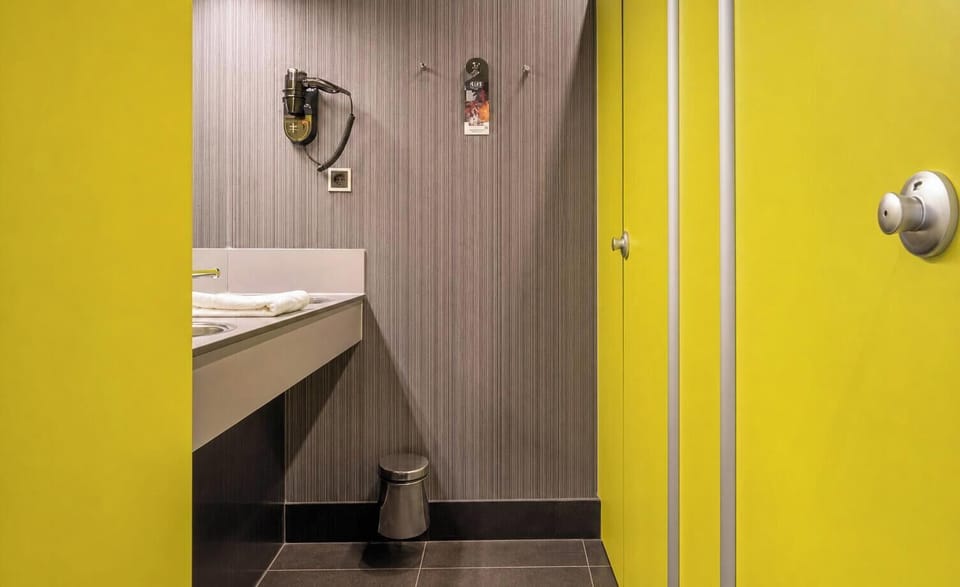 Step into a private shower area for a quick reset.