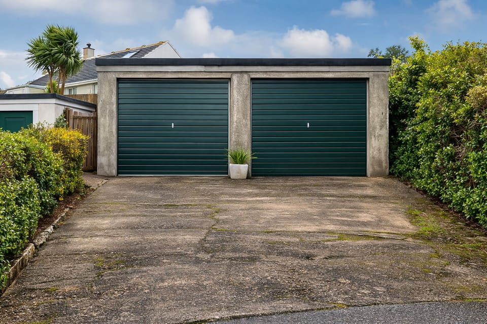 The property includes a private double garage providing secure off-street parking and convenient access for guests travelling by car.