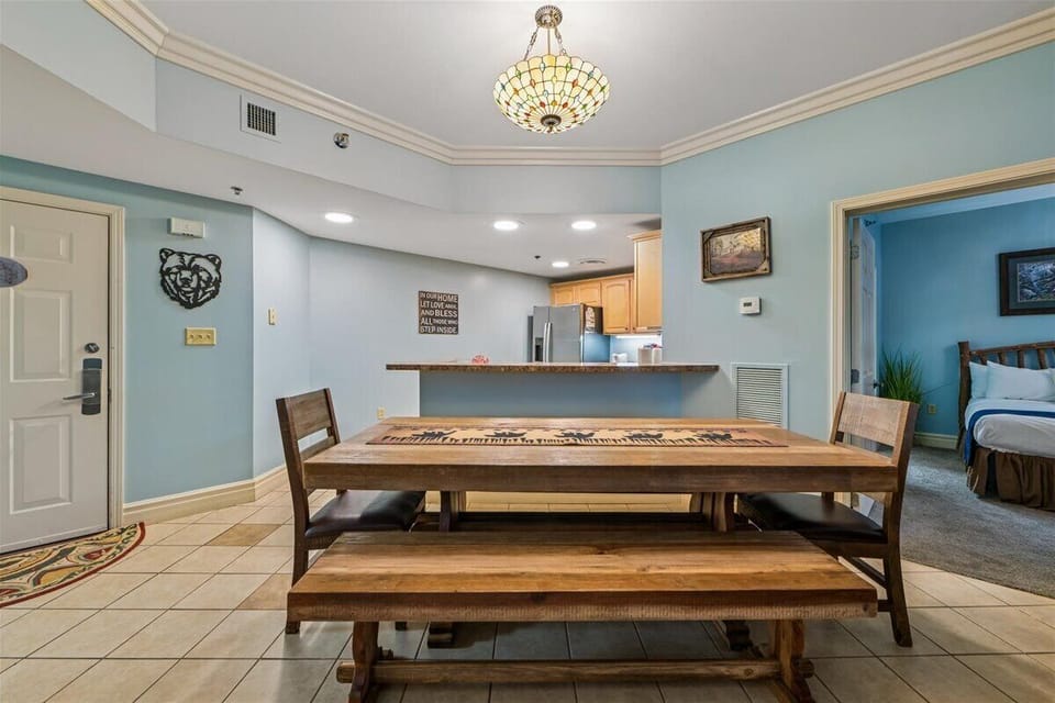 Gather around your spacious dining table with comfortable bench seating, where the open kitchen layout makes hosting effortless and memorable.