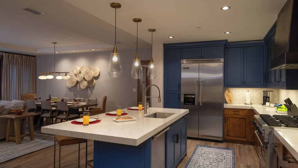 Kitchen, Main Level - Island seating with stainless steel appliances and open layout
