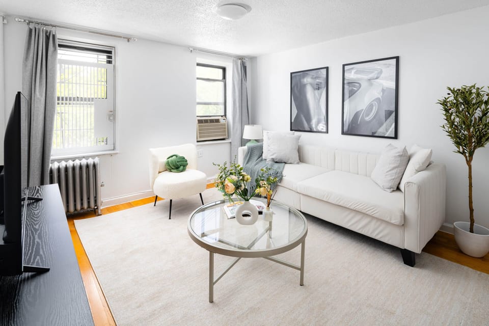 Bright kitchen with stainless appliances & stylish dining for four