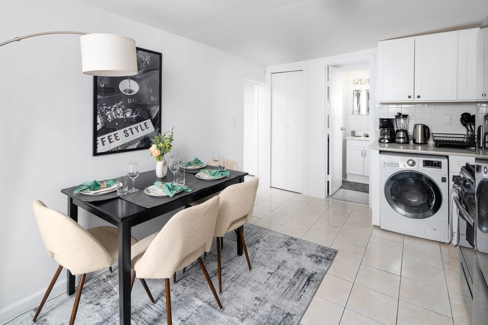 Modern dining area with seating for four & full kitchen access