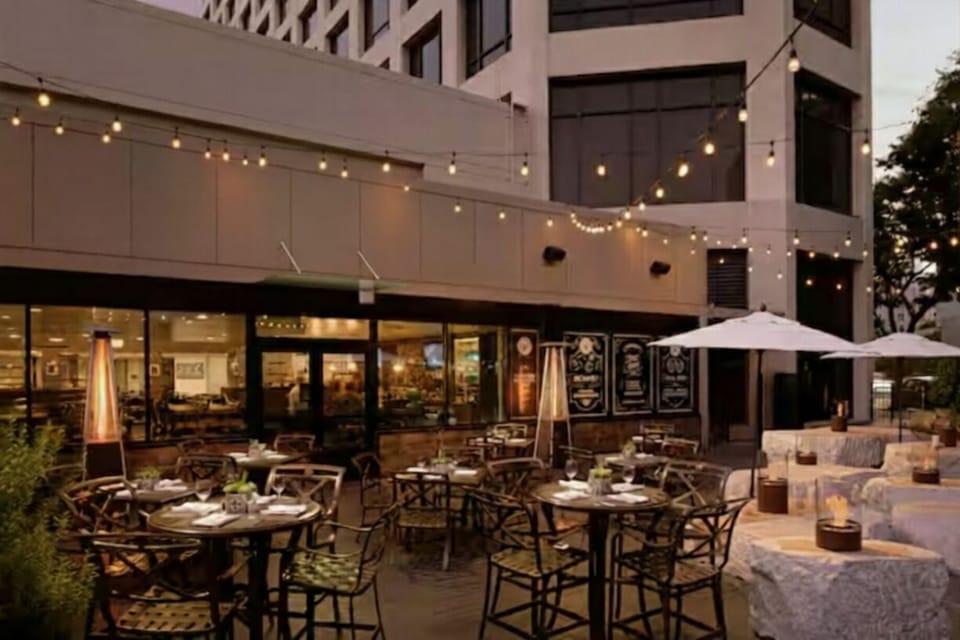 Unwind under twinkling lights with al fresco drinks and bites.