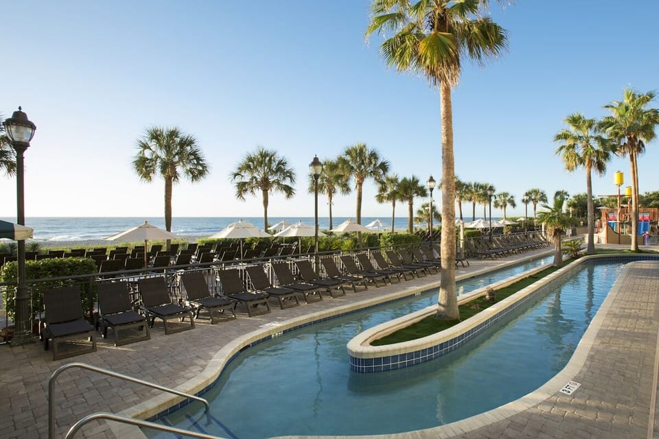 Unwind poolside with ocean breezes and endless lounge chairs.