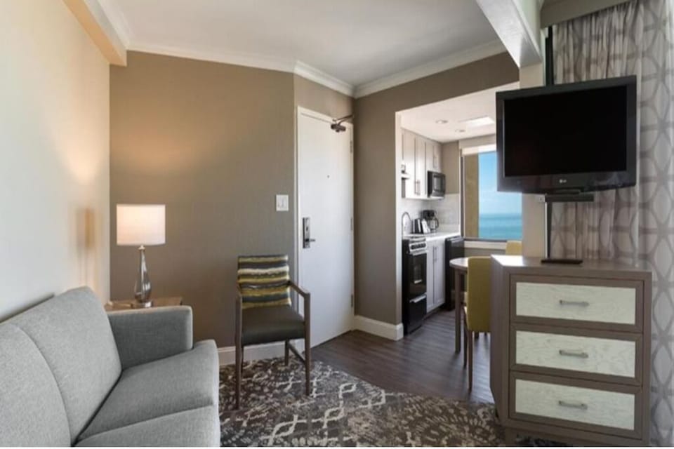 Settle in with a cozy sitting area and easy kitchenette access.