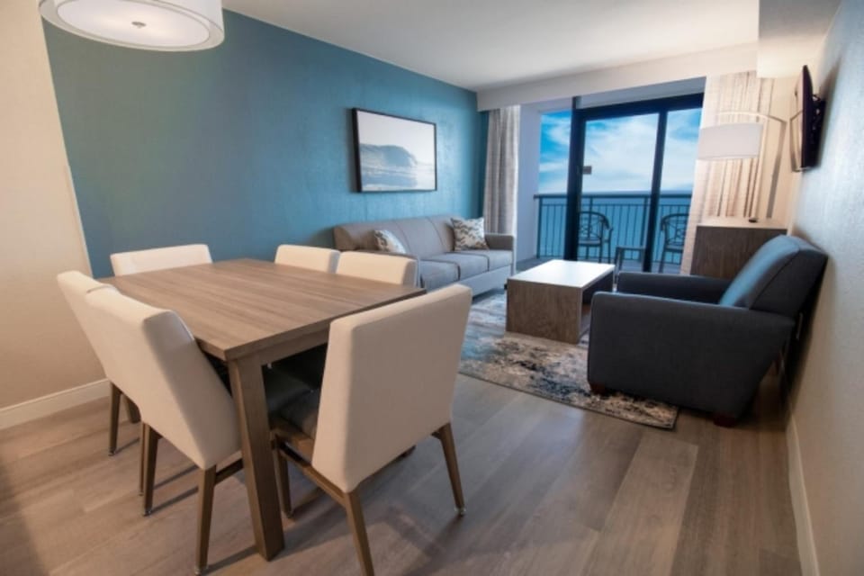 Gather for meals and movies in this open, airy suite.