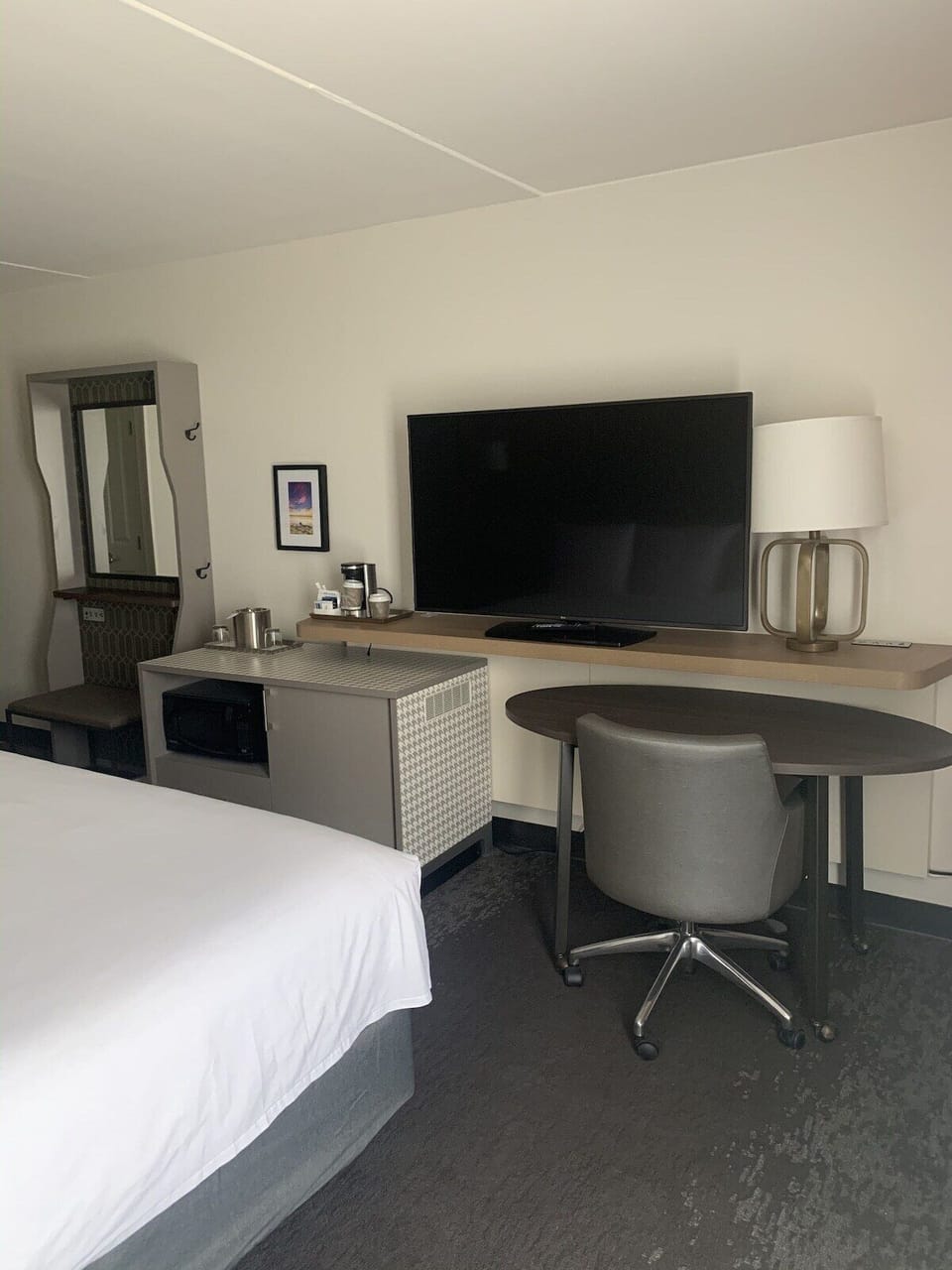 Work comfortably with a practical desk and in-room entertainment.