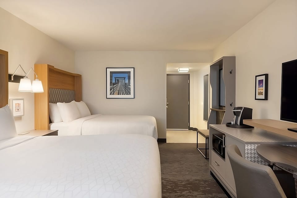 Recharge after adventures in a roomy double-queen retreat.