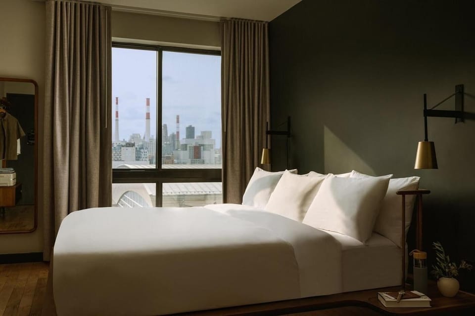 Wake up to skyline views from a plush, quiet bed.