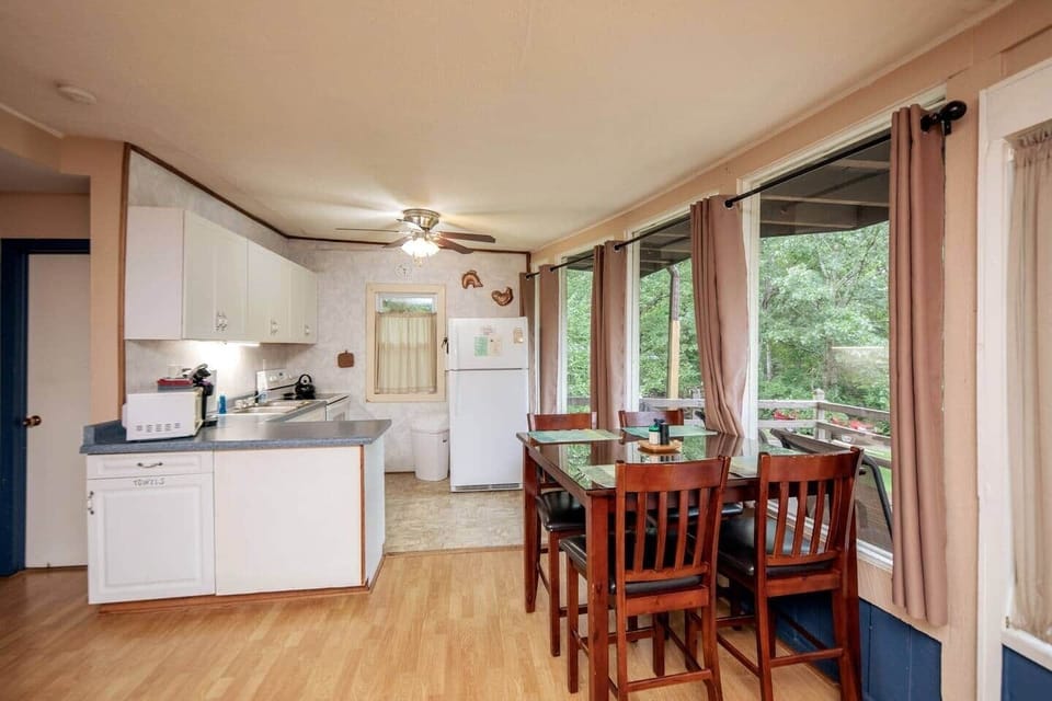 kitchen and dining area, dining table seats 4 
(4 TV tray tables available as well)