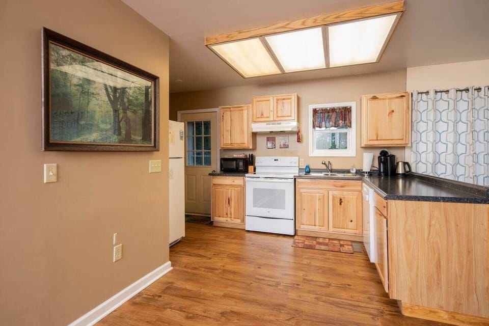 kitchen area with door leading to back deck