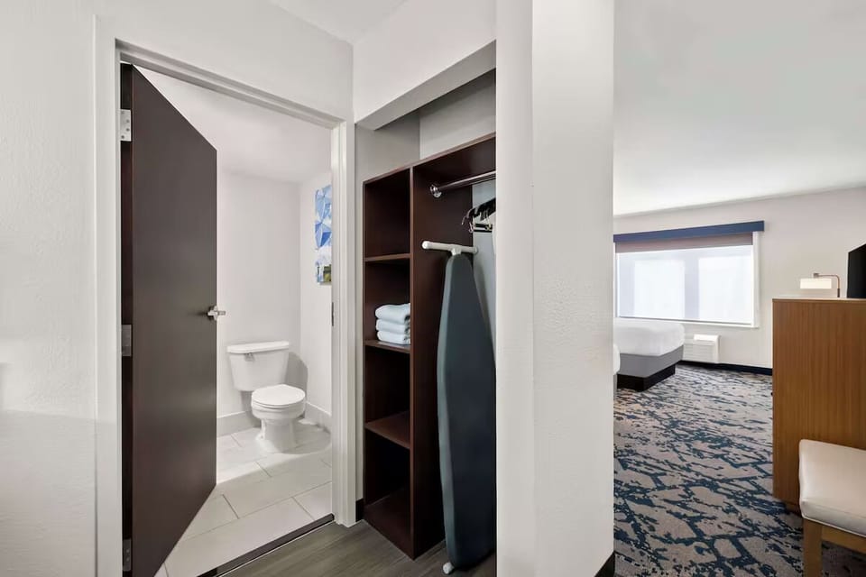 Freshen up easily with ample storage and handy ironing setup.