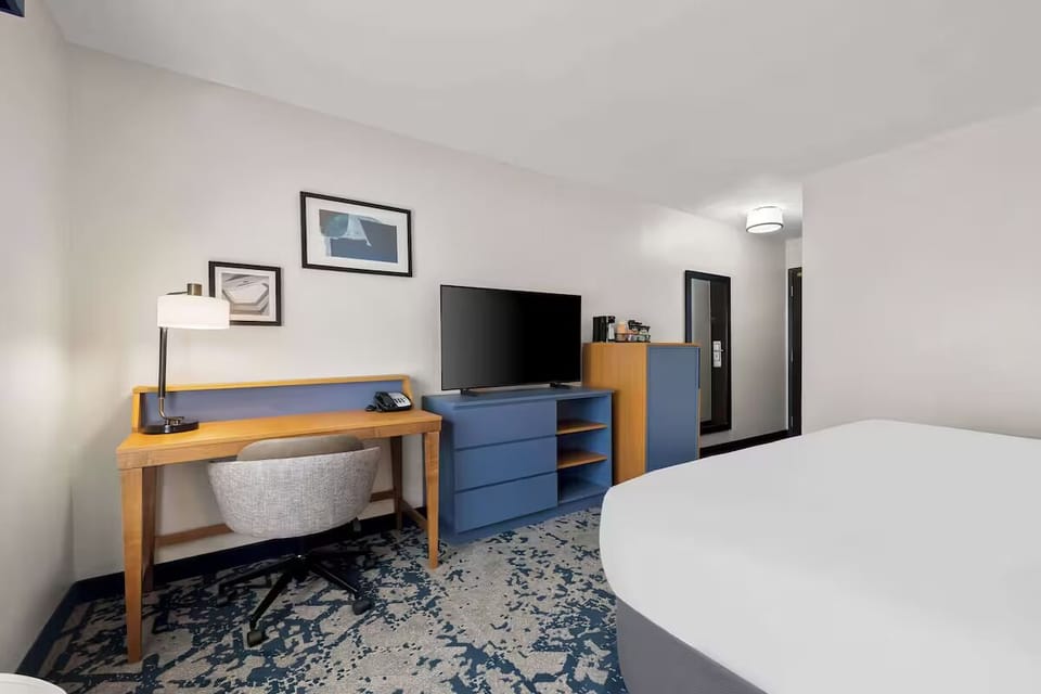 Get productive at the roomy desk, then relax with TV.