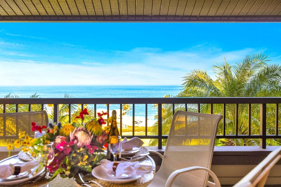 Outdoor meals feel extra special on your shaded balcony with elevated ocean and garden views. KRV-2421