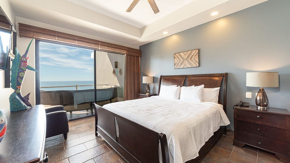 master bedroom with king bed, balcony access as well.