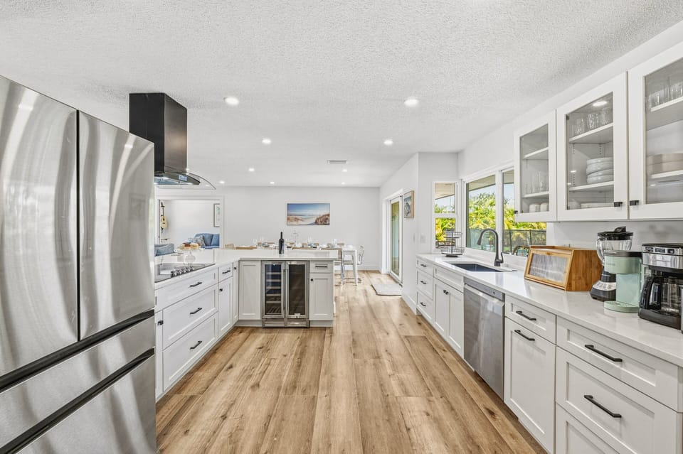 A clean, modern design with functional layout and wine cooler.