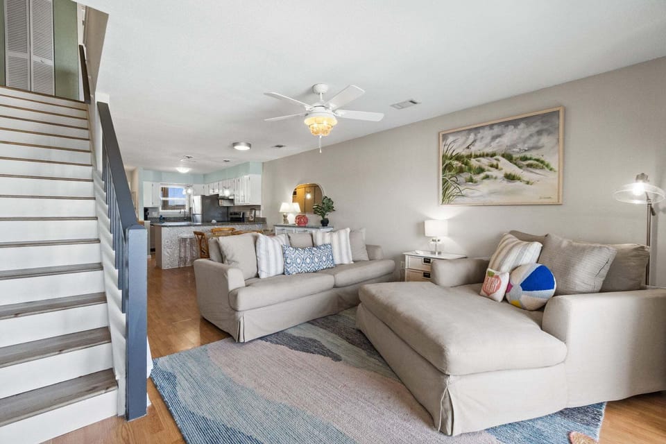 Living Room ~ Smart TV ~ Balcony Access ~ Open to Kitchen & Dining Room