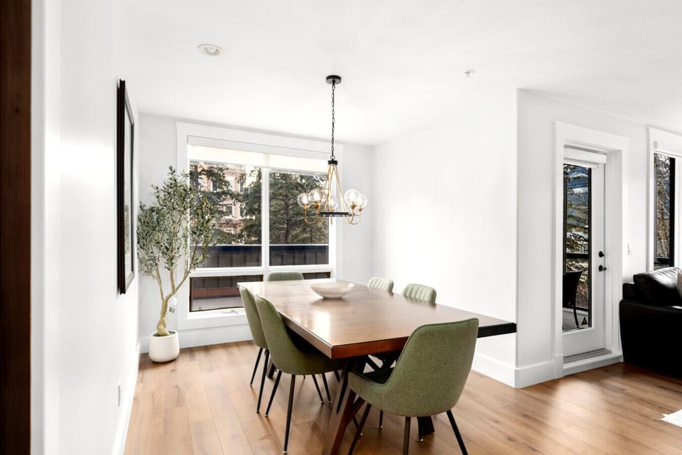 The dining table comfortably seats six, perfect for enjoying memorable meals and engaging conversations.