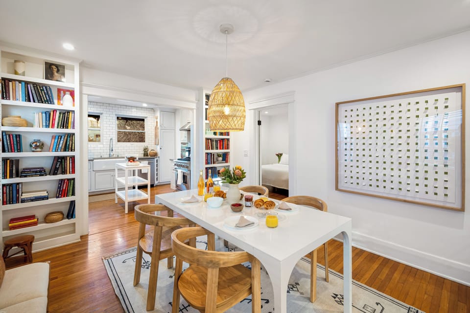 Sunny dining area with an easy flow to the kitchen and nearby bedroom.
