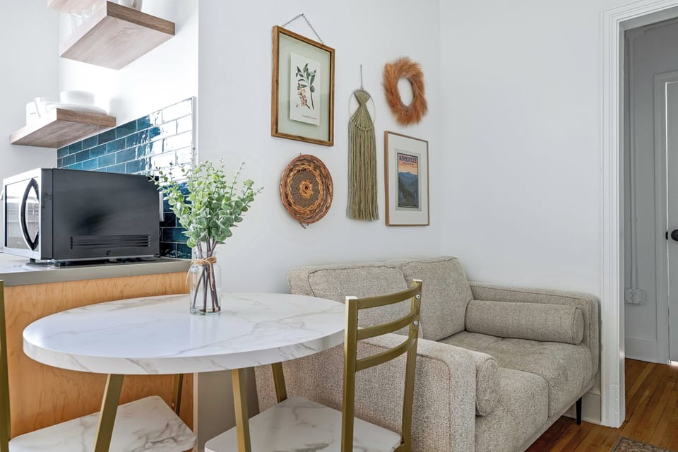 Relax on the comfortable sofa surrounded by thoughtfully curated décor and local-inspired accents — a welcoming space to unwind after a day in downtown Asheville.