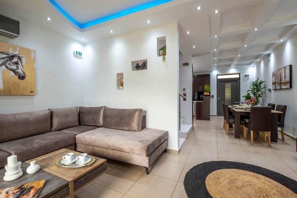 Our spacious and stylish living room provides the perfect backdrop for your stay, whether you're looking to unwind with a movie, enjoy a family game night, or simply sit back and relax...