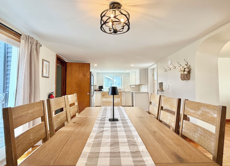 Clean, open dining space with views into the kitchen