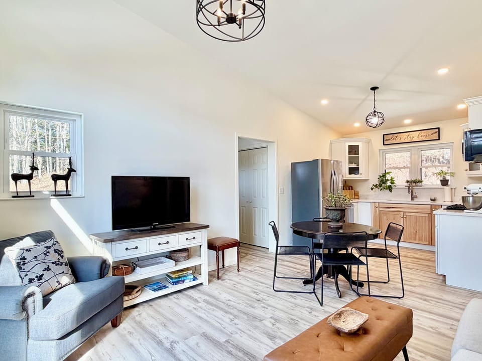 Comfortable living room with TV and seating to relax after a day out.