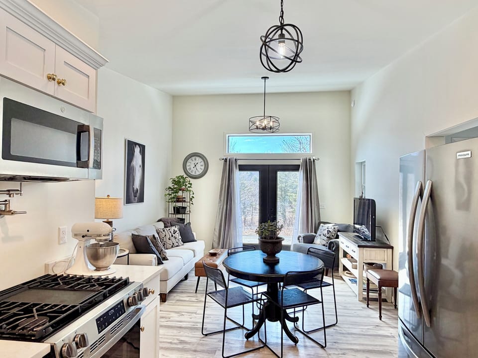 Open living area with cozy seating — perfect for relaxing after a day at Cooperstown All Star Village.