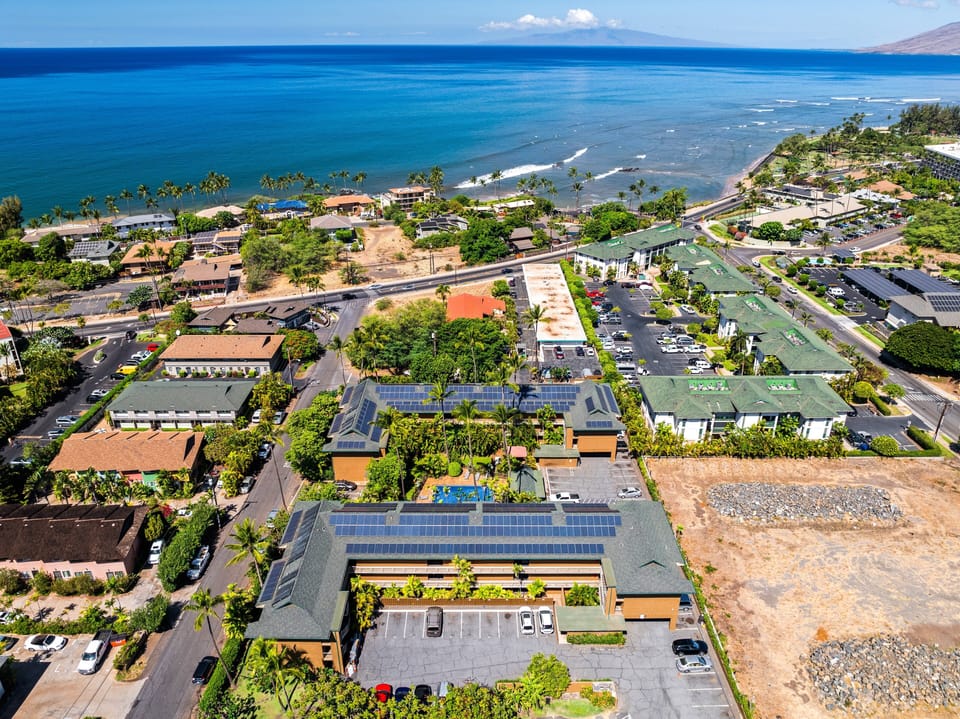 Aerial view highlighting the property's layout, tropical surroundings, and peaceful neighborhood setting.